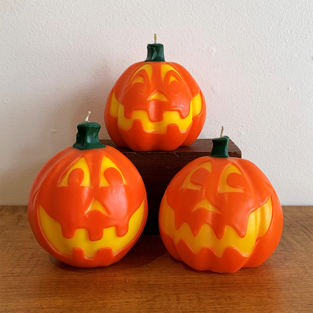 Three jack-o-lantern candles.